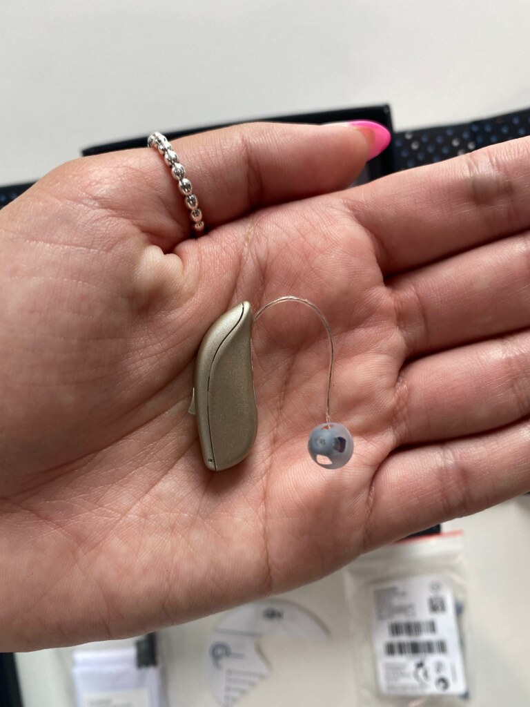 A Lively hearing aid in a palm