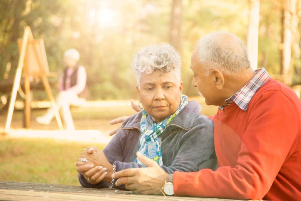 Elderly Couple Talking at park