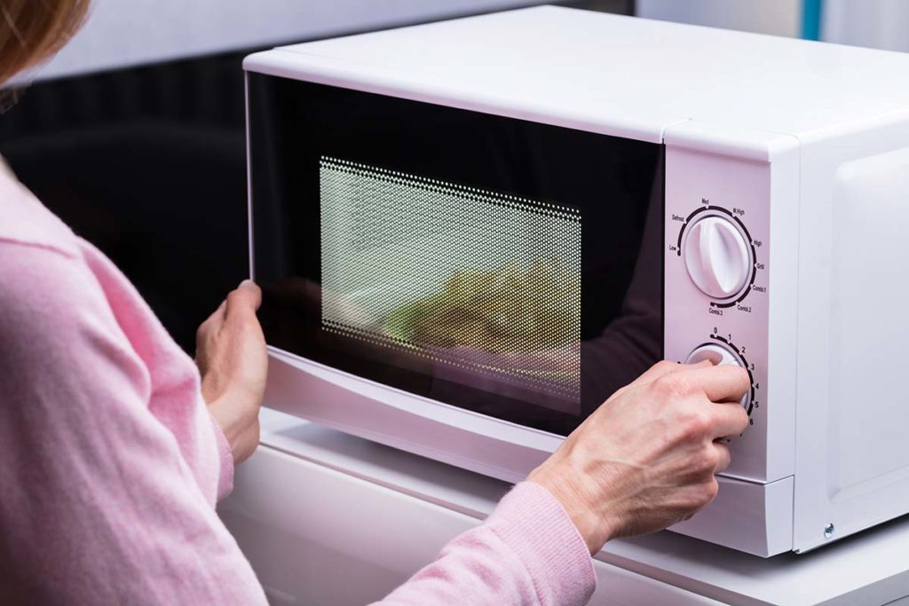 senior using microwave