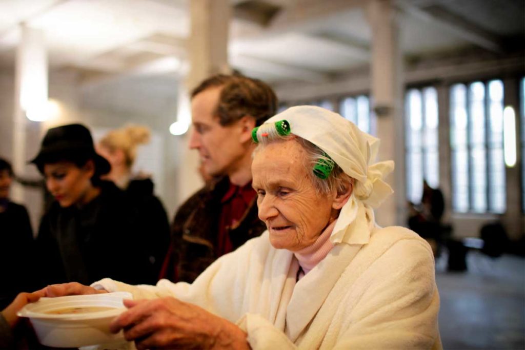 elderly woman in food line