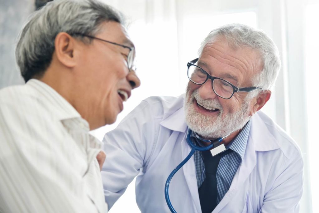 Senior man talking with doctor medigap health insurance