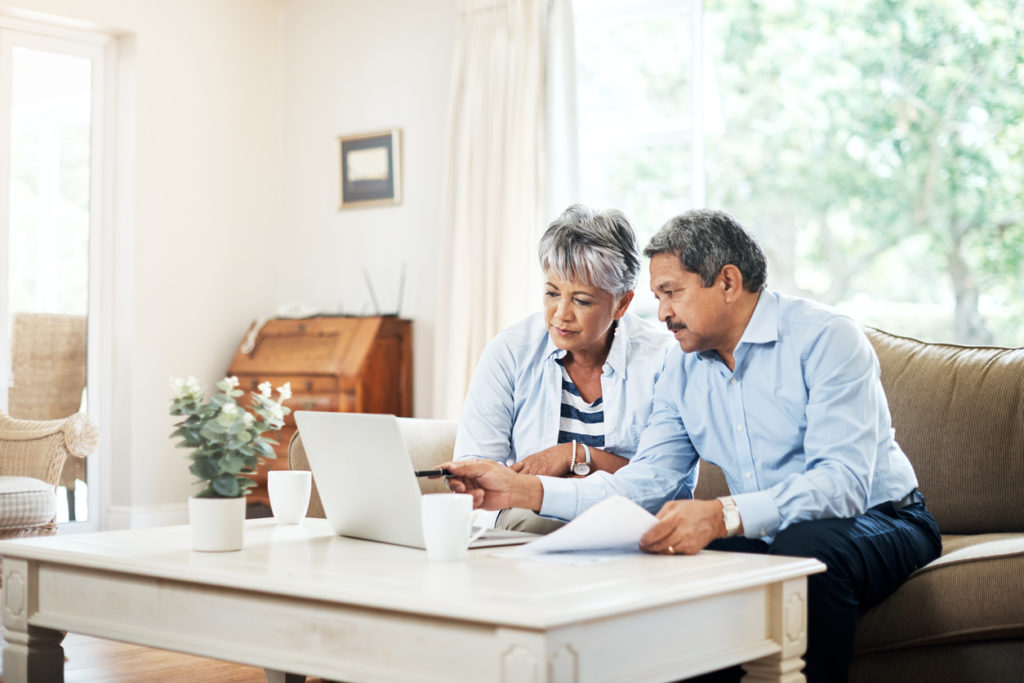 Shot of a senior couple using a laptop together at home