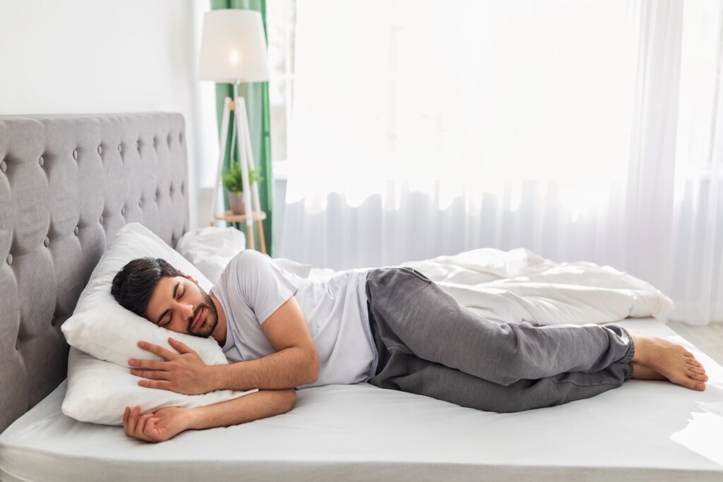 A man sleeping well on an adjustable bed