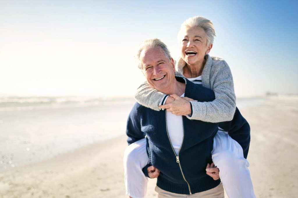 Happy senior couple on the beach