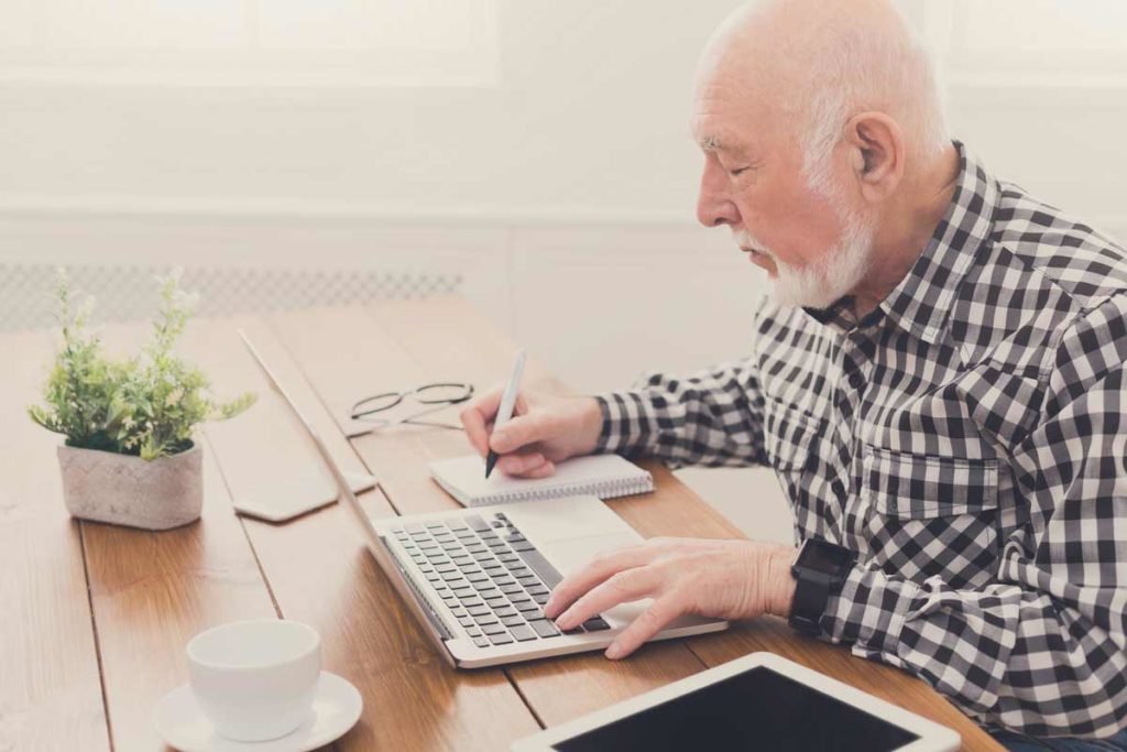 old man with laptop
