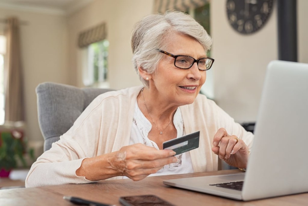 old woman paying bills online
