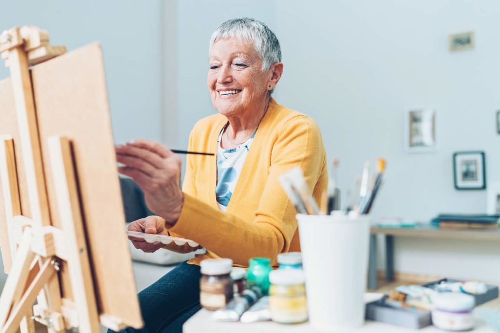 older woman painting