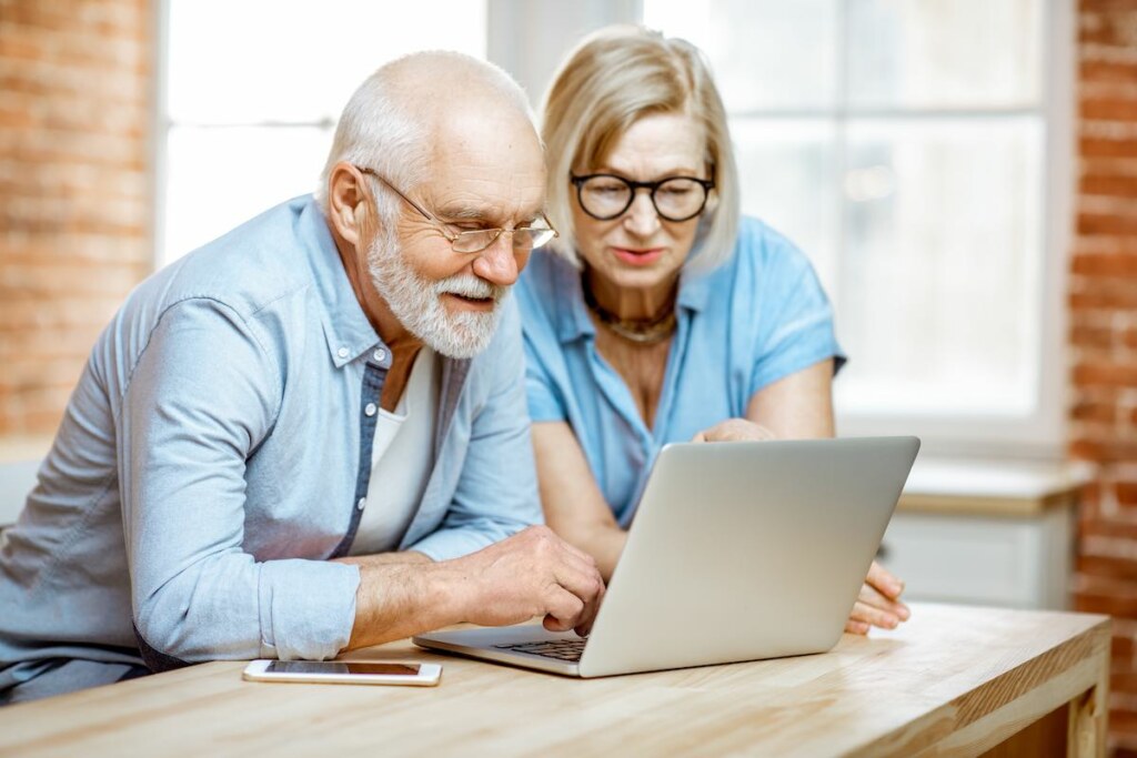 Senior couple with a laptop at home