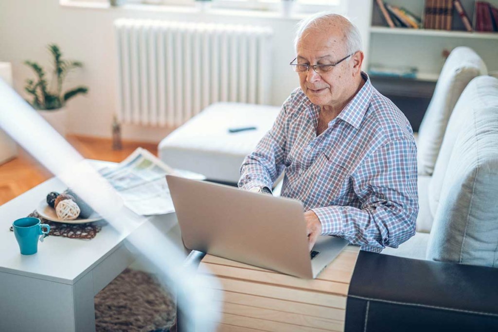 Senior man with laptop