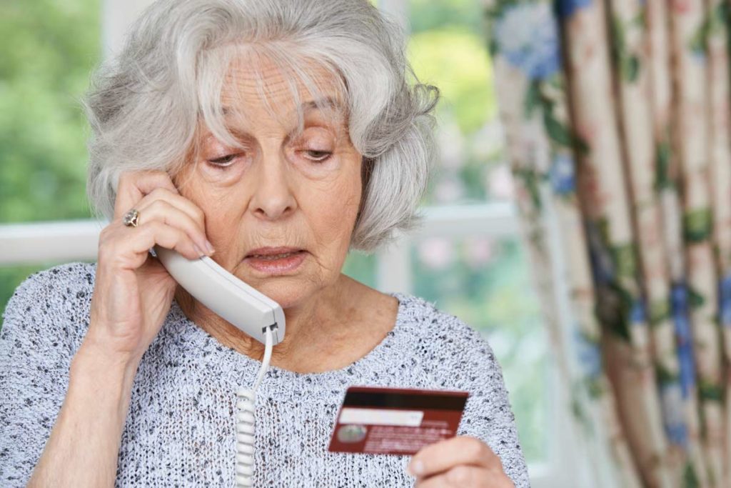senior woman on the phone scam elderly internet scam fraud
