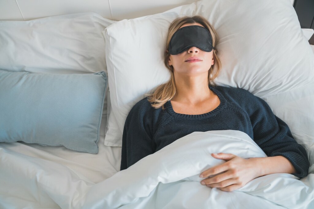 Woman sleeping on an adjustable bed