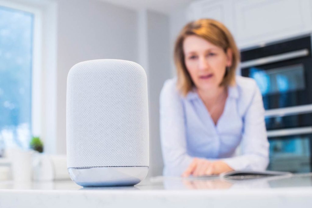 woman speaking to smart device